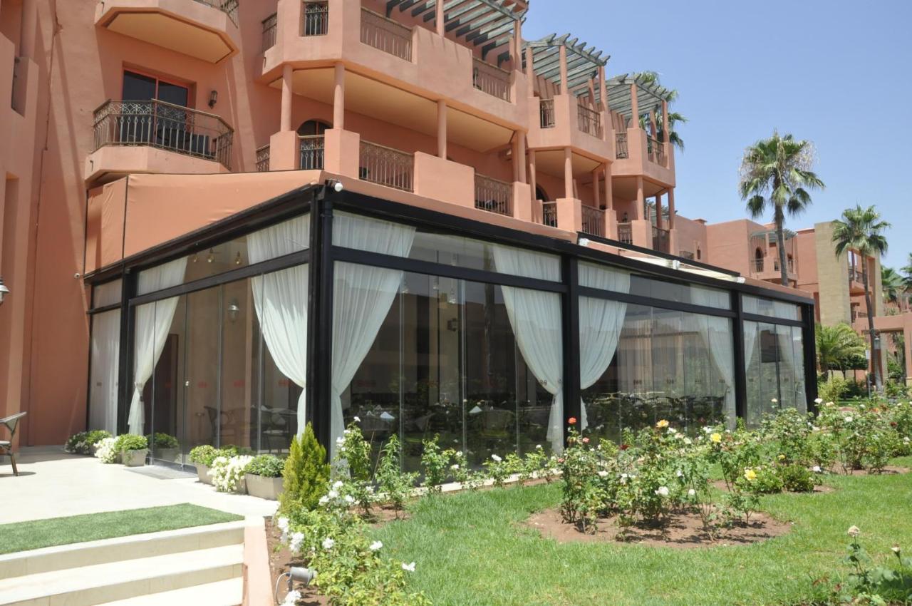 Palm Plaza Marrakech Hotel Marrakesh Exterior photo A pergola with a retractable awning